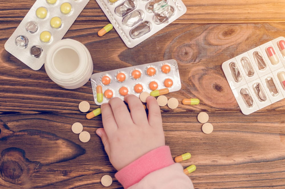 child getting into pills need for child resistant packaging