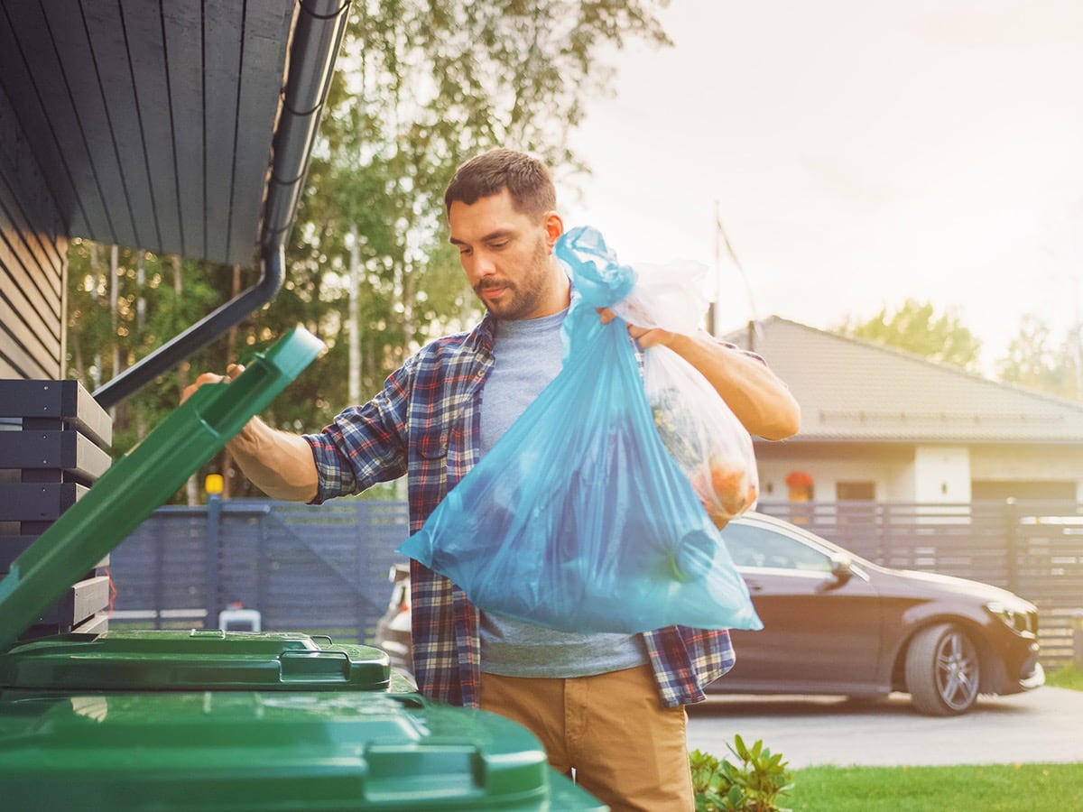 man taking out the trash