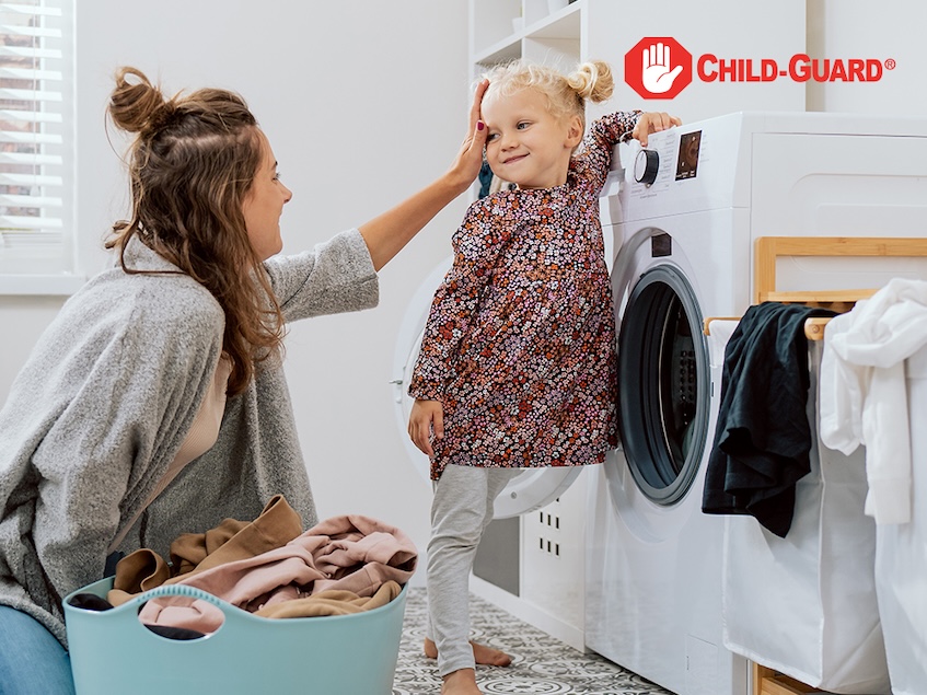 a woman and her child in a laundry room