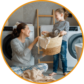 a mother and child doing laundry