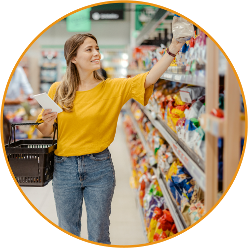 a lady in a store grabbing a product